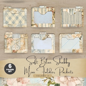 May include: A set of six mini folder pockets with a soft blue and shabby chic design. Each folder features a unique pattern, including gingham, polka dots, stripes, and floral accents. The text reads "Soft Blue Shabby Mini Folder Pockets Volume I".