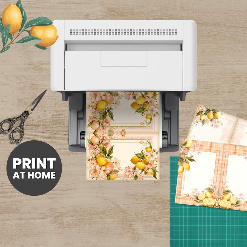 a printer, scissors, and some printed materials on a wooden surface.