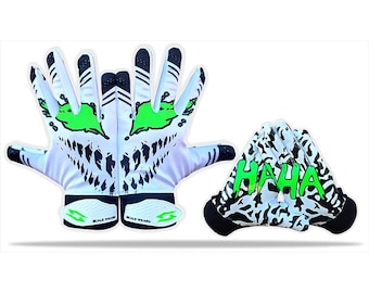 May include: White and black football gloves with a green and black design. One pair of gloves has a green "HAHA" text design. The other pair has a green and black face design.