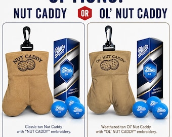 May include: Two tan fabric pouches with black clips, each featuring embroidered text and a graphic of two golf balls. One pouch reads NUT CADDY, the other OL' NUT CADDY. Each set includes a blue box labeled Blue Balls and three blue golf balls.