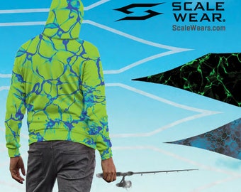 May include: A person wearing a lime green hoodie with a blue marbled pattern, holding a fishing rod. The hoodie has a hood and long sleeves. The background features a blue sky and the Scale Wear logo.