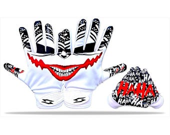 May include: White and black football gloves with a red Joker smile design. The fingers have a black and white pattern. A matching helmet with the word "HAHA" in red is also included.