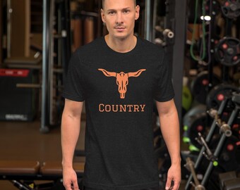 May include: A black t-shirt with an orange graphic of a longhorn skull with the word "COUNTRY" underneath.