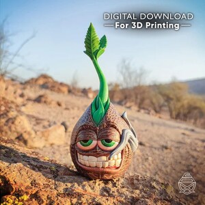 Puede incluir: Una figura caprichosa impresa en 3D de una semilla germinando con una cara sonriente y ojos verdes. El cuerpo marrón y texturizado tiene un brote verde. El texto "DIGITAL DOWNLOAD - For 3D Printing" está en la parte superior.