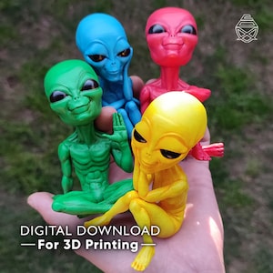 May include: Four colorful alien figurines in green, blue, red, and yellow are displayed. The aliens have large eyes and are in various poses. The text "DIGITAL DOWNLOAD - For 3D Printing" is at the bottom of the image.