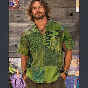 May include: A short-sleeved shirt in various shades of green featuring a patchwork design with multiple patterns including geometric shapes, zigzags, and floral motifs. The shirt has a mandarin collar, a partial button-down front, and a chest pocket.
