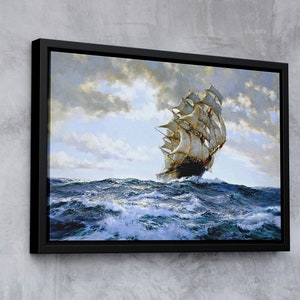 Puede incluir: Una pintura enmarcada de un gran barco de vela con velas blancas, navegando por aguas azules agitadas bajo un cielo nublado.