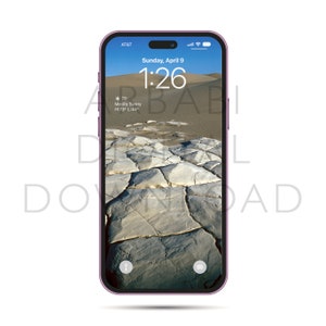 May include: A purple iPhone with a cracked earth landscape as the background image. The time is 1:26 and the date is Sunday, April 9. The weather is mostly sunny with a high of 73 degrees and a low of 44 degrees.