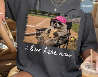 Personalized I Live Here Now Raccoon Softball Mom Shirt, Custom Funny Raccoon Softball Mom T-Shirt