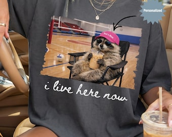 Personalized I Live Here Now Raccoon Volleyball Mom Shirt, Custom Funny Raccoon Volleyball Mom T-Shirt