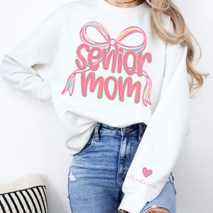 Personalized Senior Mom Sweatshirt with Sleeve Name, Coquette Bow Preppy 2026 Senior Mom, Senior Mama, Gift for Senior Mom