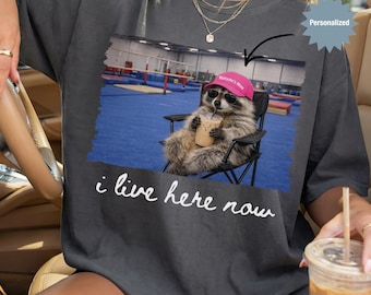 Personalized I Live Here Now Raccoon Gymnastics Mom Shirt, Custom Funny Raccoon Gymnastics Mom T-Shirt