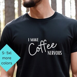 May include: Black t-shirt with white text that reads "I make coffee nervous".