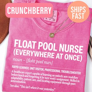 May include: A bright pink short-sleeved t-shirt featuring white text that defines a float pool nurse as a rapid learner and professional troubleshooter. The shirt includes a phonetic pronunciation and a humorous description of nursing duties.