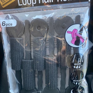 May include: A package of six black loop hair rollers. The package is labeled "Loop Hair Rollers" and "#BTLTO9BLA". The package also includes the text "Soft and flexible | Easy to use | Great for setting or perming hair".