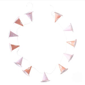 May include: A string of pink and orange witch hats with white crescent moon and star designs. The hats are strung together with white string and are perfect for a Halloween party or a whimsical nursery decor.