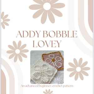 May include: A crochet pattern titled "ADDY BOBBLE LOVEY" with a daisy theme. The image features two crocheted squares, one white and one pink, with a floral design. The text "An advanced beginner crochet pattern" is also included.
