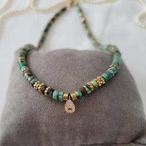 African turquoise and hematite heishi bead necklace with rhinestone drop pendant