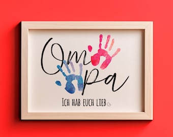 May include: A framed print with the words "Oma Opa" in black script with two handprints in watercolor, one blue and one pink, and the text "Ich hab euch lieb" in black script below the handprints.