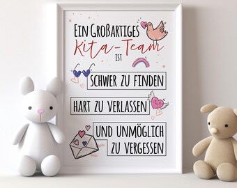 May include: A white framed print with a pink and blue illustration of a bird, a rainbow, sunglasses, and hearts. The text reads "Ein großartiges Kita-Team ist schwer zu finden, hart zu verlassen und unmöglich zu vergessen."