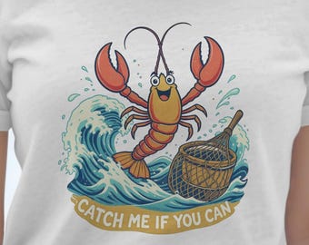 Catch Me If You Can Lobster Graphic Tee, Fun Cartoon Lobster and Net Design, Ocean Wave Lobster TShirt, Coastal Themed Novelty Tee