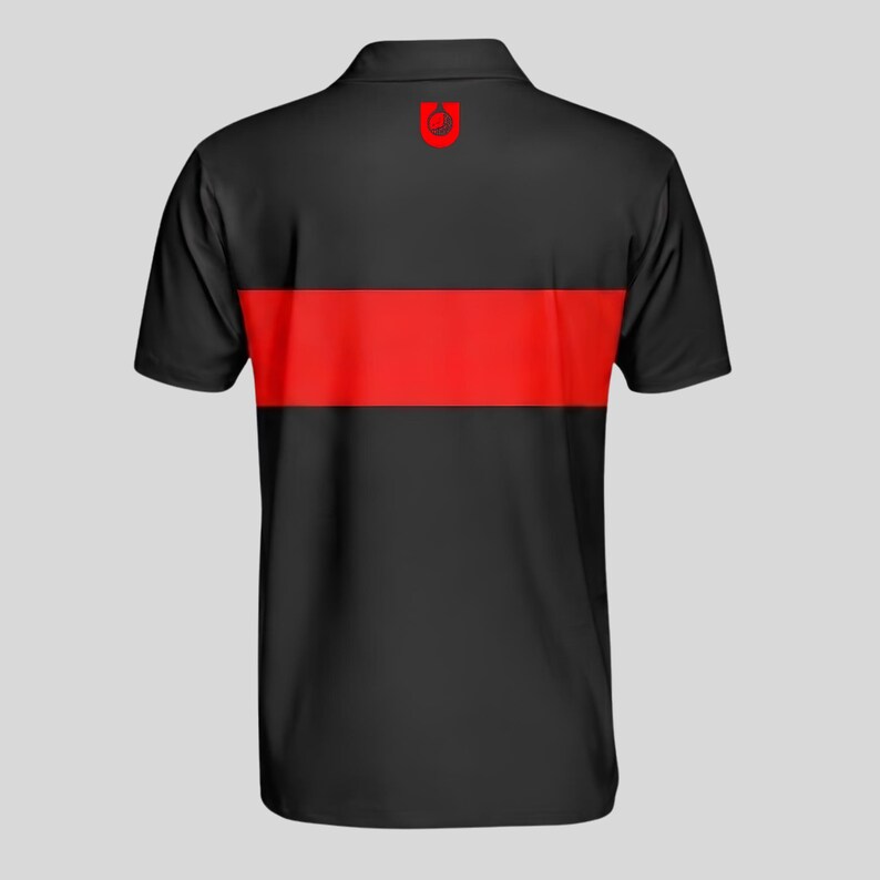 Back view of a black men's golf polo with a bright red chest stripe and red golf ball emblem printed below the collar.