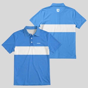 Front and back of a powder blue men's golf polo with white chest stripe, chest logo and white golf ball emblem below the back collar.