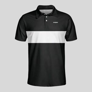 Front view of a black men's golf polo with a wide white chest stripe, three-button placket and small white Unanimous Golf logo on the chest.