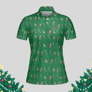Green short-sleeve golf polo with a repeating Christmas print of Santa, reindeer, and candy canes.