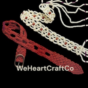 May include: A red crocheted belt with a silver buckle and openwork design is shown with a cream-coloured crocheted belt with brown beads. The image also shows a cream-coloured macrame piece with multiple cords. The text "WeHeartCraftCo" is visible.