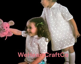 May include: Two young children in white crocheted outfits. One holds a pink toy mouse. The outfits feature collared necklines and short sleeves. The image includes the text "We Heart CraftCo" in pink.