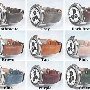 May include: A collection of smartwatches with various colored leather bands. Colors include anthracite, gray, dark brown, brown, tan, pink, blue, purple, and green. Each watch has a silver-colored case and a white watch face with black detailing.