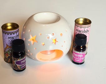 Juego de regalo de quemador de aceite con estrellas iridiscentes y aceites aromáticos