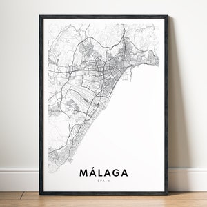May include: A black and white map print of Málaga, Spain, with the city name and country printed below the map.