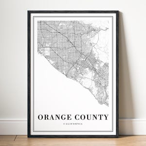 May include: Black and white map print of Orange County, California, in a black frame.