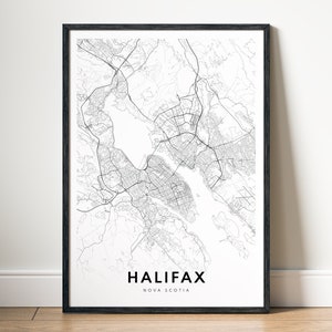 May include: Black and white map print of Halifax, Nova Scotia, in a black frame. The map shows the city's streets and waterways.