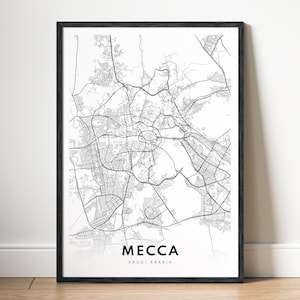 Pode incluir: Um mapa de arte de linha em preto e branco de Meca, Arábia Saudita. O mapa mostra as ruas e pontos de referência da cidade. As palavras "Meca" e "Arábia Saudita" estão impressas abaixo do mapa.
