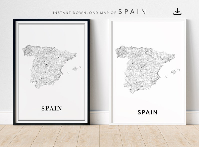 May include: Two black and white printable maps of Spain with a detailed road network. The maps are framed in black and white frames and are displayed on a light wood floor.