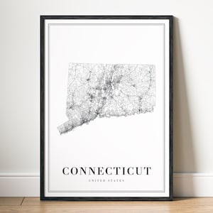 May include: A framed black and white map print of Connecticut, USA. The map details the state's roads and cities. The word "CONNECTICUT" is printed in a bold font below the map, with "UNITED STATES" below it.