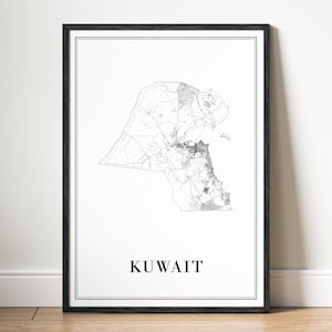 May include: A framed monochrome map of Kuwait. The map details roads and urban areas. The word "KUWAIT" is printed in a simple, bold font at the bottom of the frame. The frame is black and the background is white.
