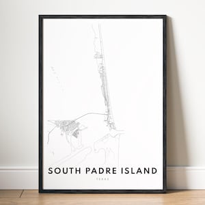 May include: A framed vertical wall art print featuring a minimalist black and white map of South Padre Island, Texas. The design displays thin black lines representing the island's geography and road network on a stark white background.