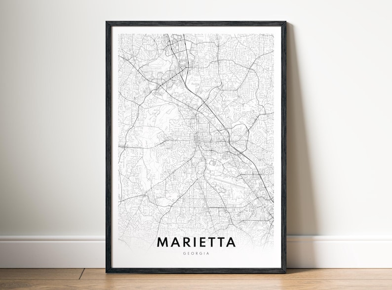 May include: Black and white city map print of Marietta, Georgia. The map shows the streets and roads of the city.