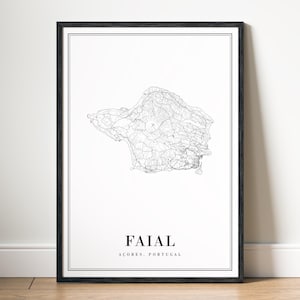 May include: A framed black and white print of Faial, Azores, Portugal. The print features a detailed map of the island, with the name "Faial" and "Acores, Portugal" printed in a minimalist font at the bottom. The frame is black.