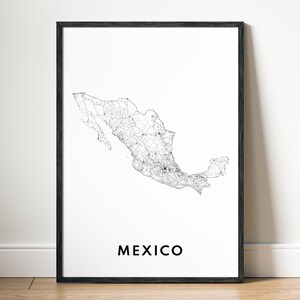 May include: A framed print featuring a detailed black and white map of Mexico. The map highlights roads and geographical features. The word "MEXICO" is printed in a bold, black font at the bottom of the print.