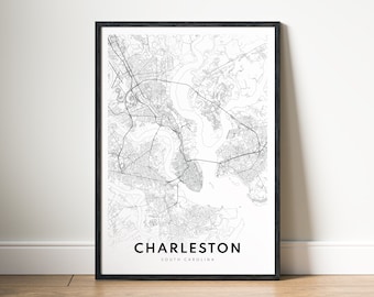 May include: Black and white map print of Charleston, South Carolina, in a black frame. The map shows the city's streets and waterways.