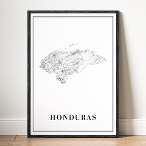 May include: A framed print featuring a detailed black and white map of Honduras. The map is centered on a white background, with the country's outline and internal features clearly visible. The word "HONDURAS" is printed in a simple font at the bottom.