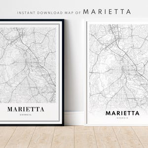May include: Black and white printable map of Marietta, Georgia. The map shows the city streets and roads. The text "Marietta, Georgia" is printed at the bottom of the map.