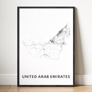 May include: Framed art print featuring a detailed black and white map of the United Arab Emirates. The country's outline and internal road network are visible. The words "UNITED ARAB EMIRATES" are printed in a bold, black font at the bottom.