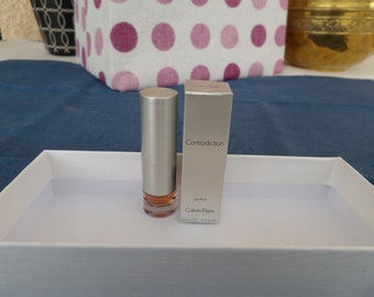 Miniatura de perfume de mujer, CONTRADICTION de Calvin Klein.PERFUME de mujer completo en miniatura 3,7 ml impecable.