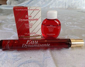 Eau Dynamisante de CLARINS    soit une  miniature +   un vapo de sac   (  pour 25 ml d'eau de toilette )